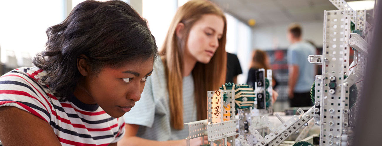 Two female students working together on a project