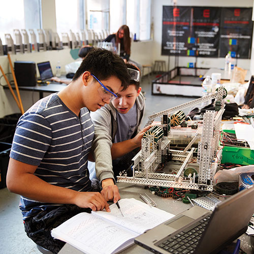 Two male students working together on a project