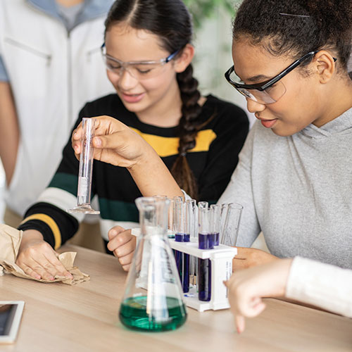 Two female students working with test tubes